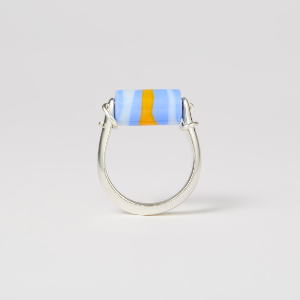 sterling silver and glass  kinetic ring with colorful blue and white bead