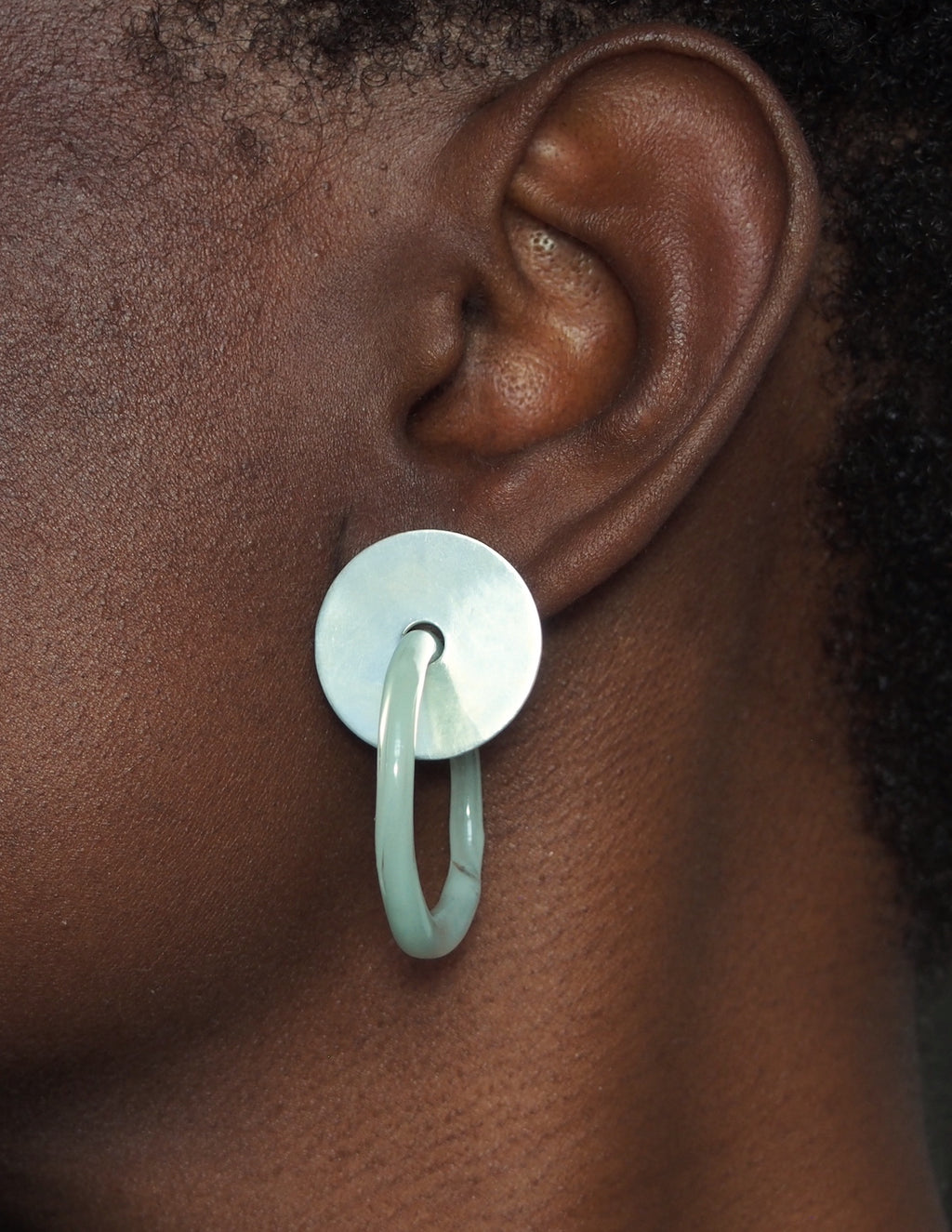 green glass hoop earrings with sterling silver stud shown on mondel