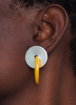 model wearing sterling silver earring with yellow glass hoop