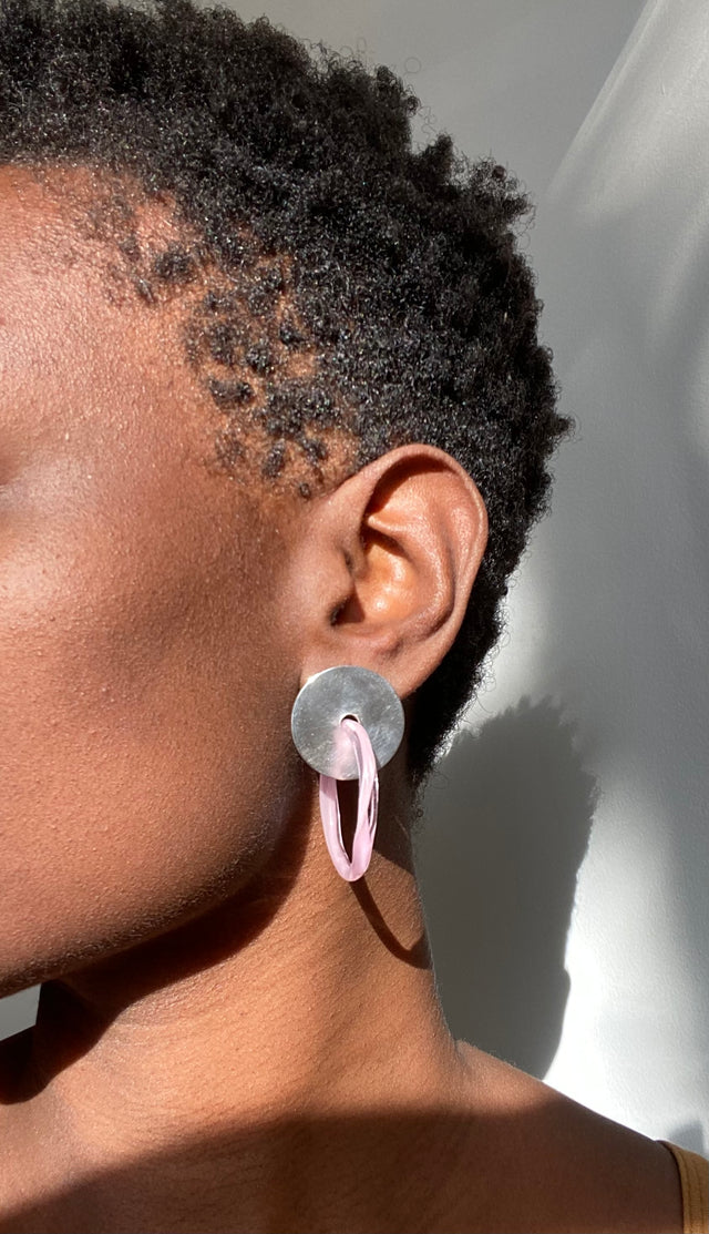 model image wearing pink glass hoop earrings